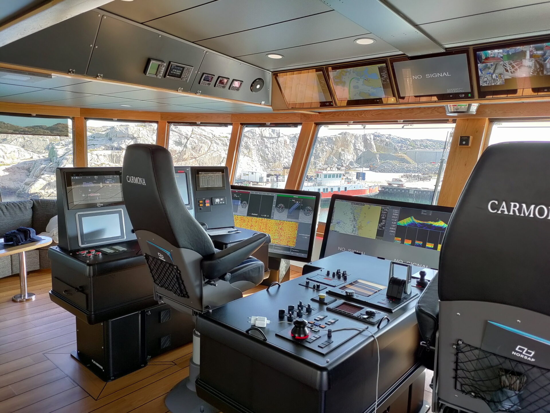 Furuno bridge installed on a boat, powered by Kramer - from the boat's window you can see the snowy mountains