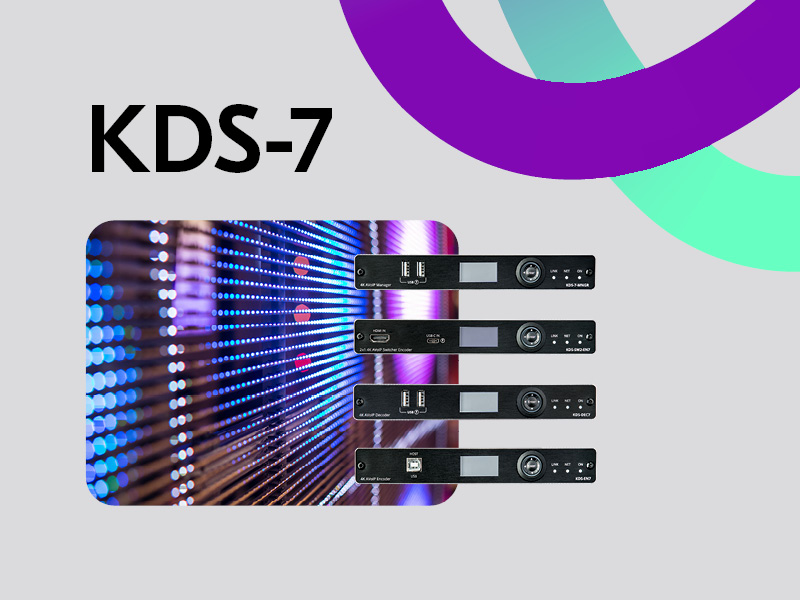 Kramer KDS-7 AVoIP black devices over the background of a shiny screen with colorful lights