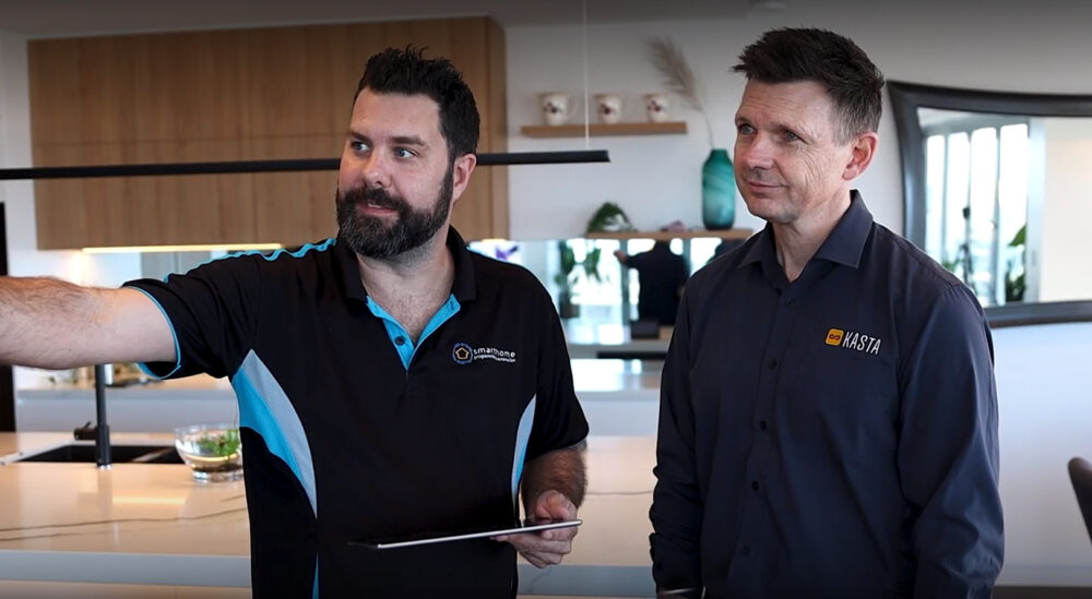 Two technicians of KASTA Technologies, AU, discussing Kramer's Smart Home Control solution