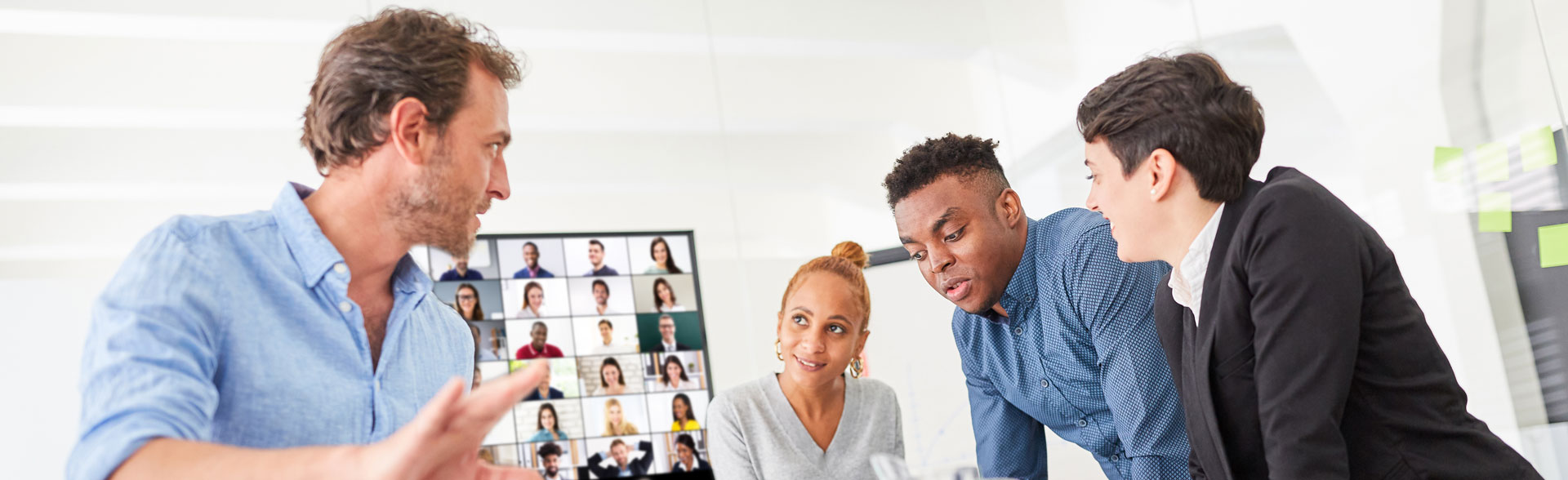 People standing in an office, talking