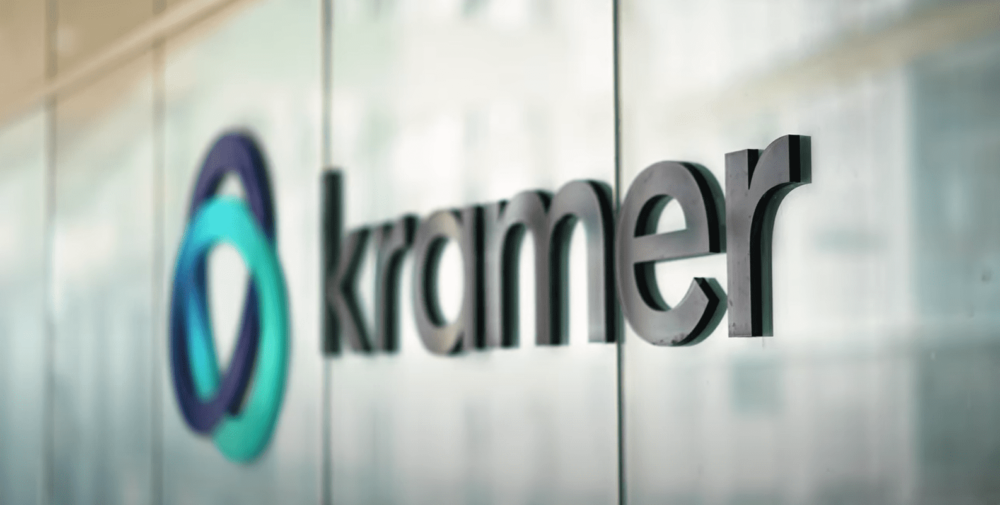 Kramer's new office logo, on a glass-tiled wall