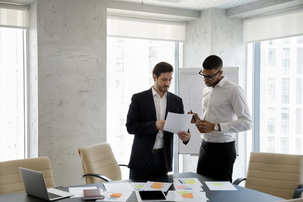 Two men talking, discussing Kramer's site audit