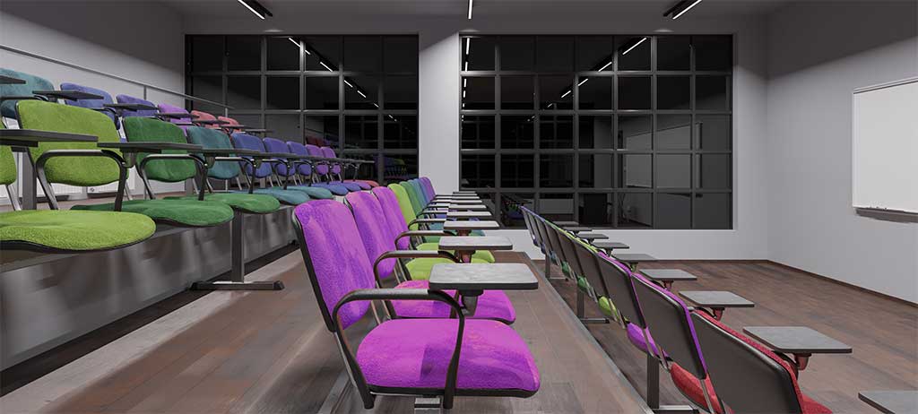 An auditorium hall, with purple and green seats