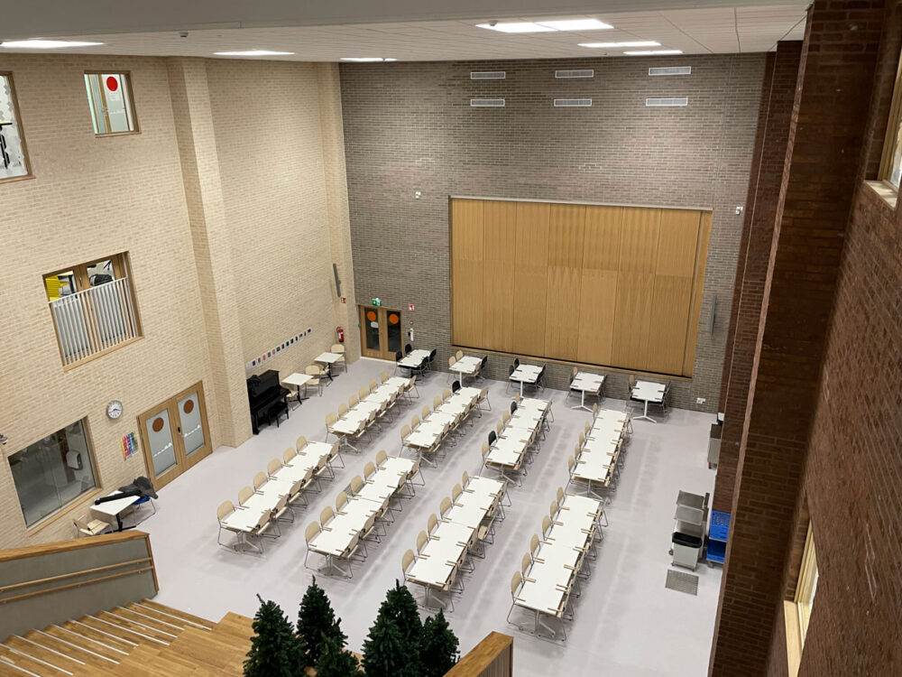 A hall at an education center, shot from above, with Kramer AVoIP solution installed in it
