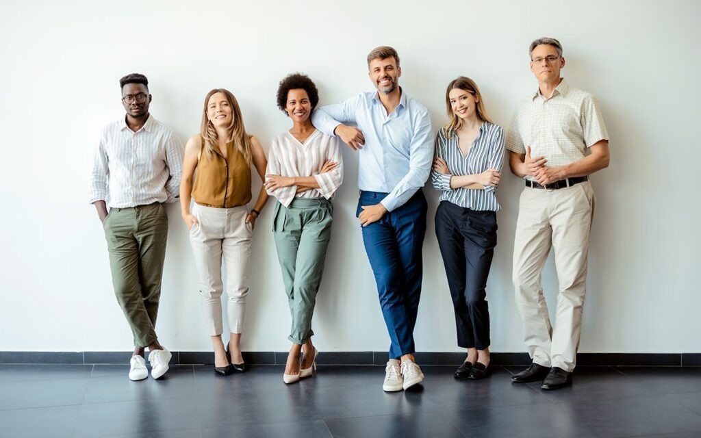 Six people standing, smiling at the camera